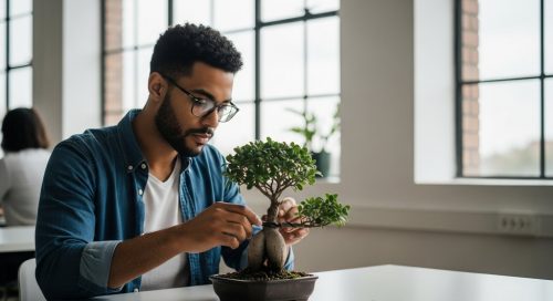 Ein SEO Manager pflegt in einem modernen Büro einen Bonsai-Baum, als Symbol für nachhaltiges Inhouse SEO-Wachstum.